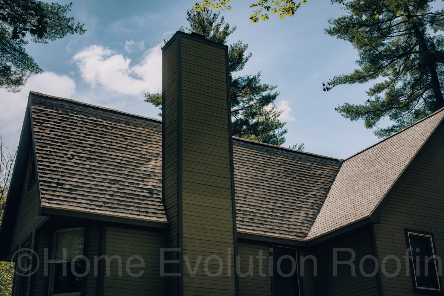 A professional chimney inspector using a camera to check for blockages.