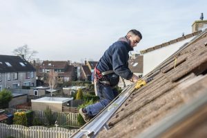man working on a roof