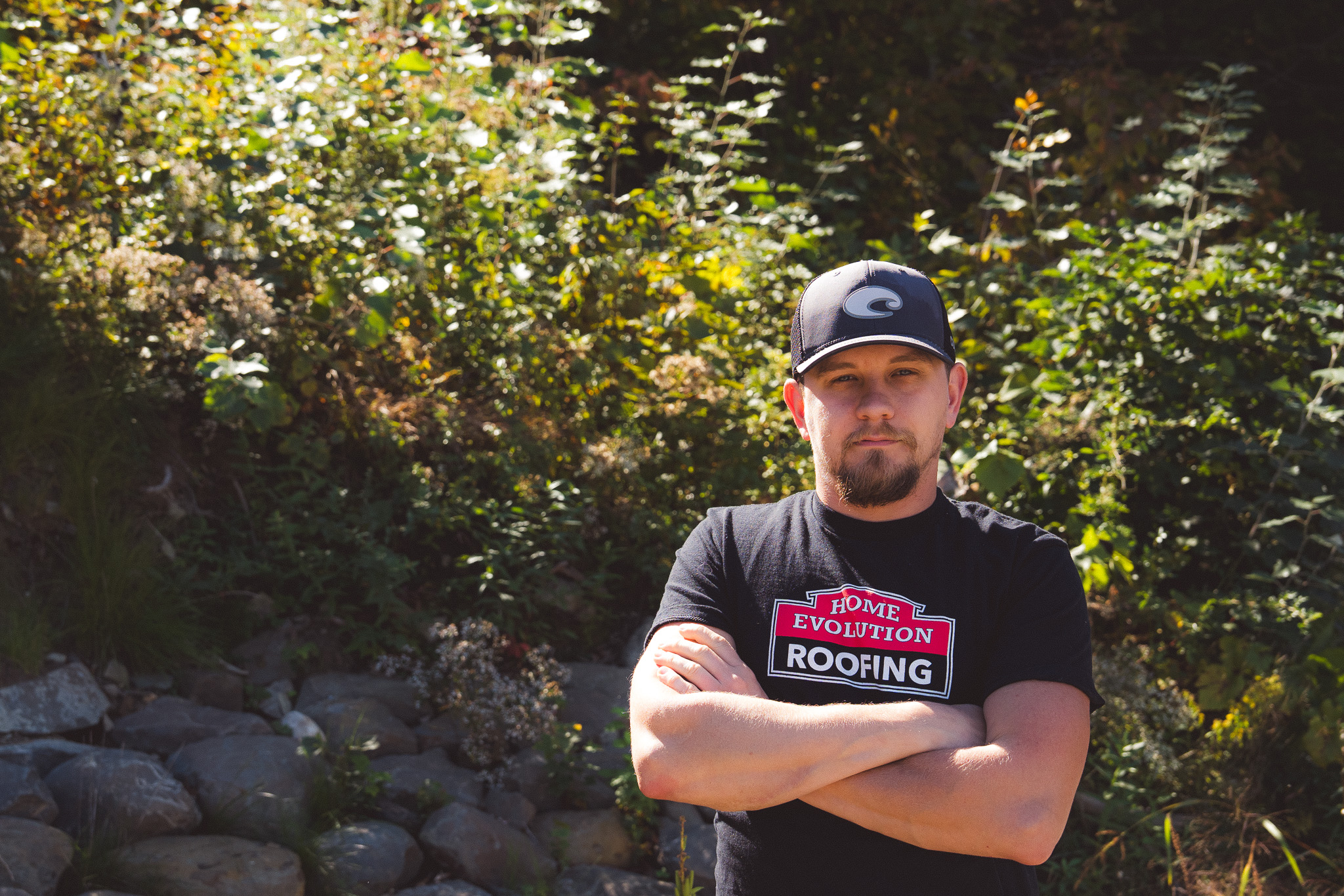 Roof repair specialist inspecting an older home's roof in Albany, NY