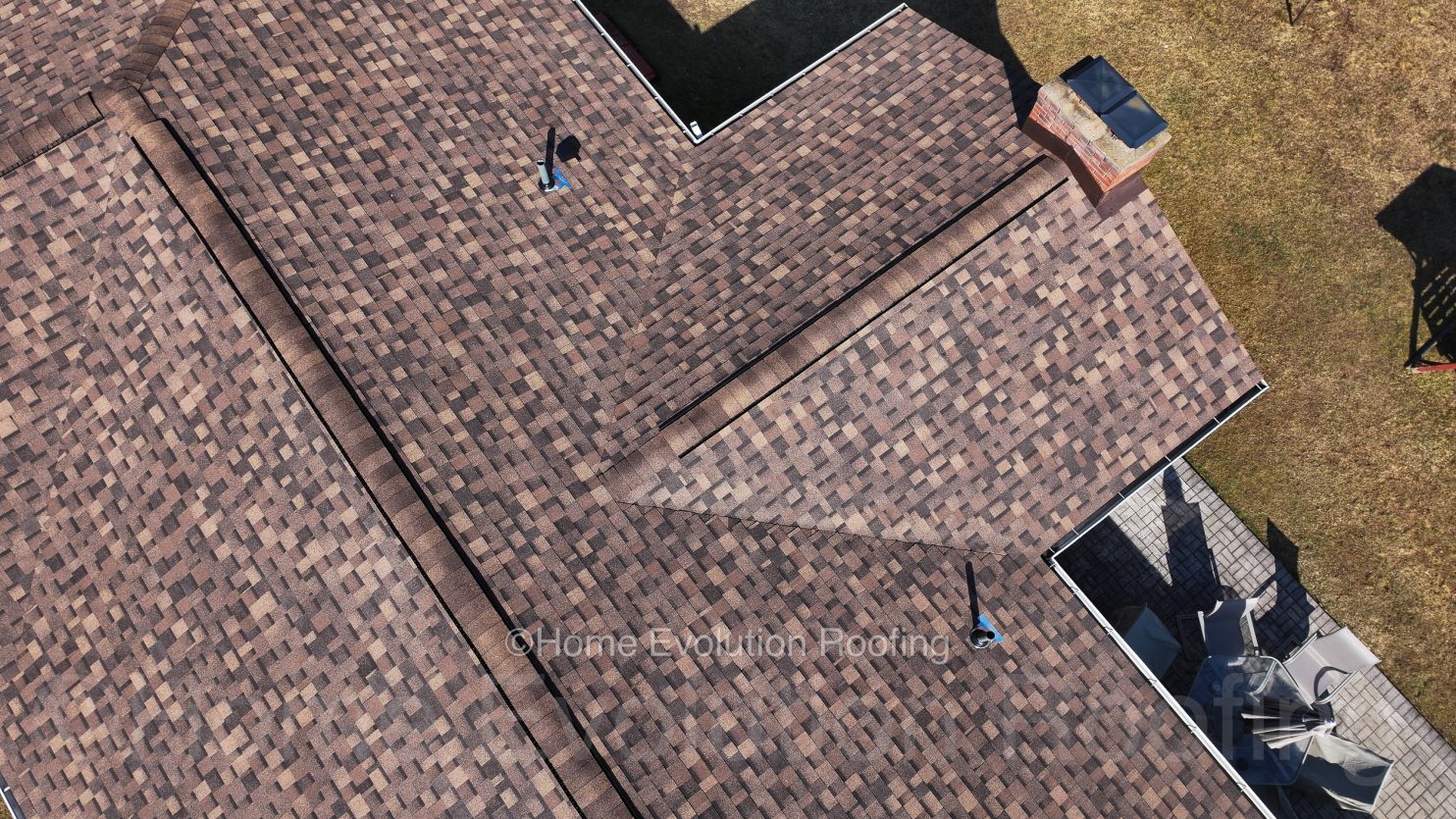 A modern sustainable roof in Poughkeepsie featuring eco-friendly materials and solar panels.