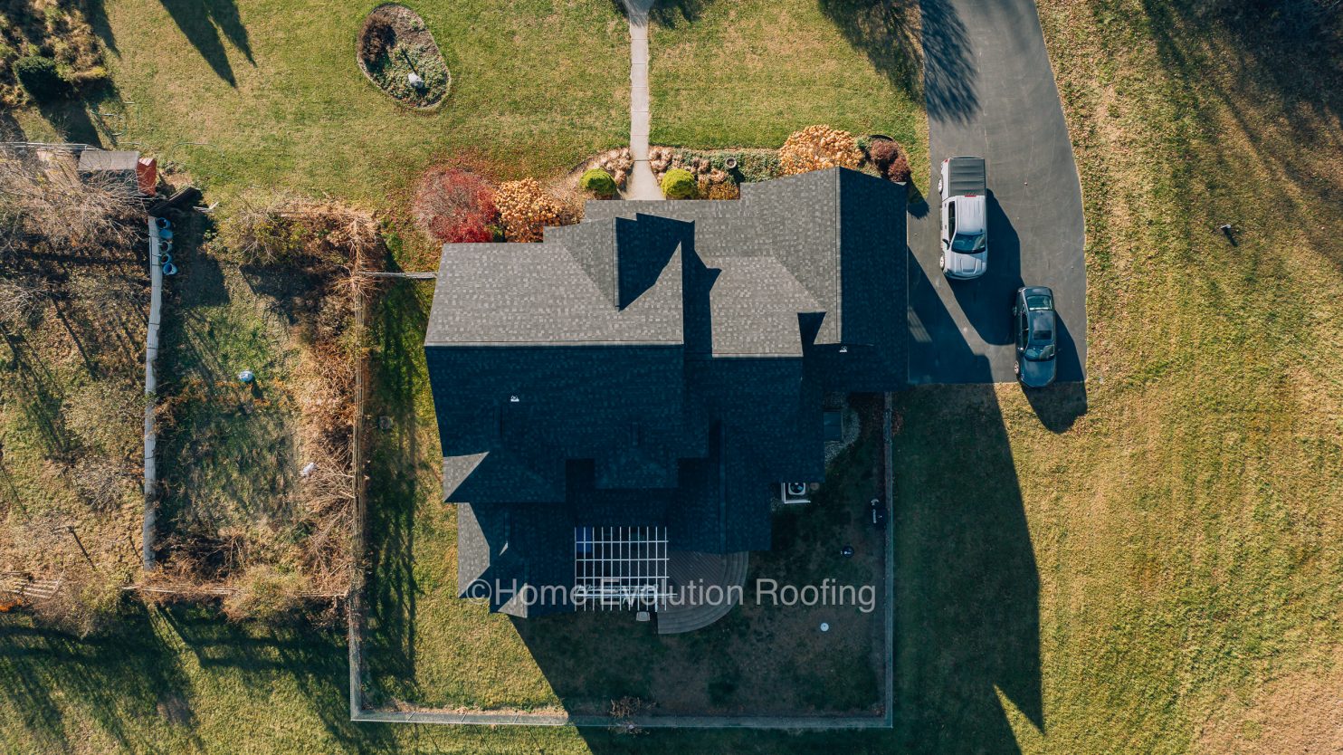Professional roofers replacing a roof in Watervliet NY with high-quality materials.