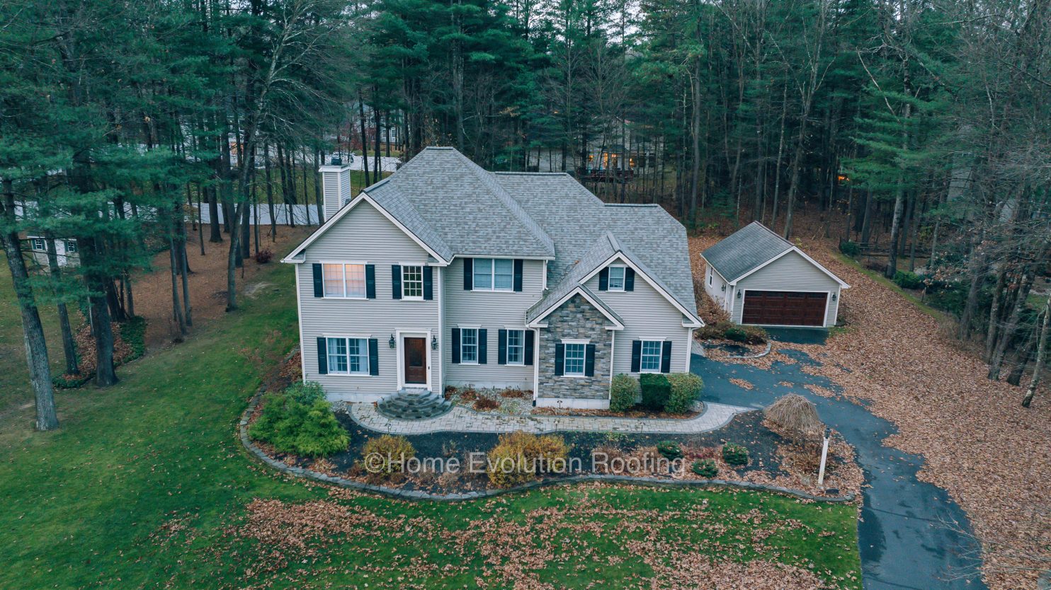 Roofing expert inspecting a home’s roof in Oneonta NY