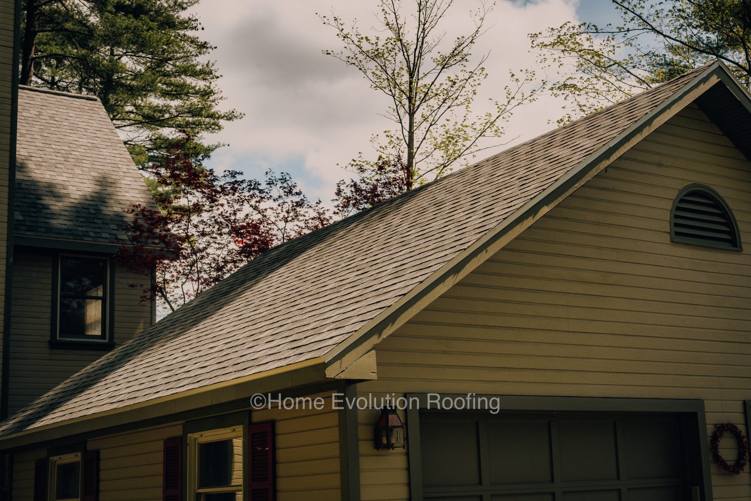 Well-maintained Poughkeepsie roof under a bright summer sky ensuring durability and protection.