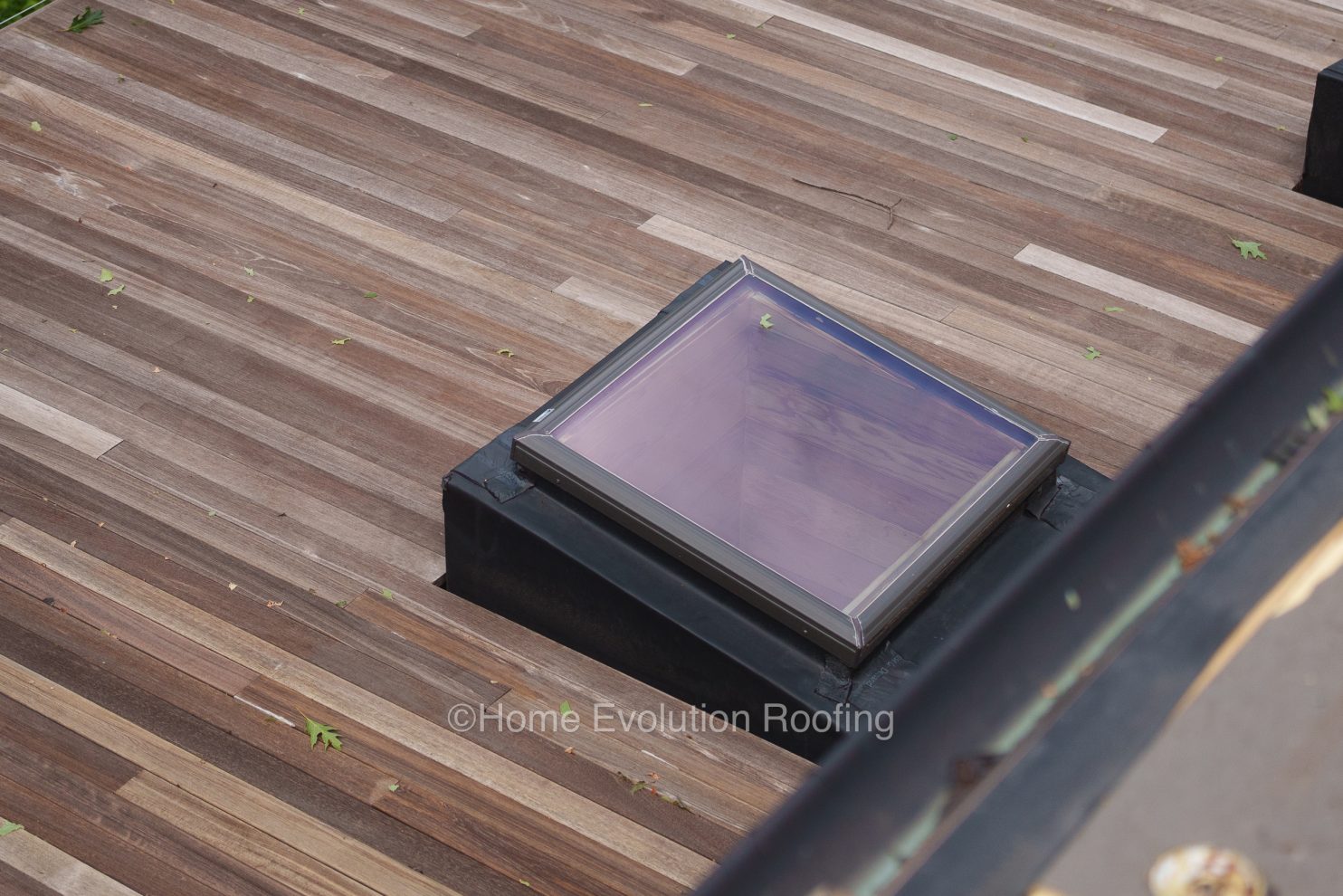 A modern home in Poughkeepsie with a beautifully installed skylight, filling the room with natural light