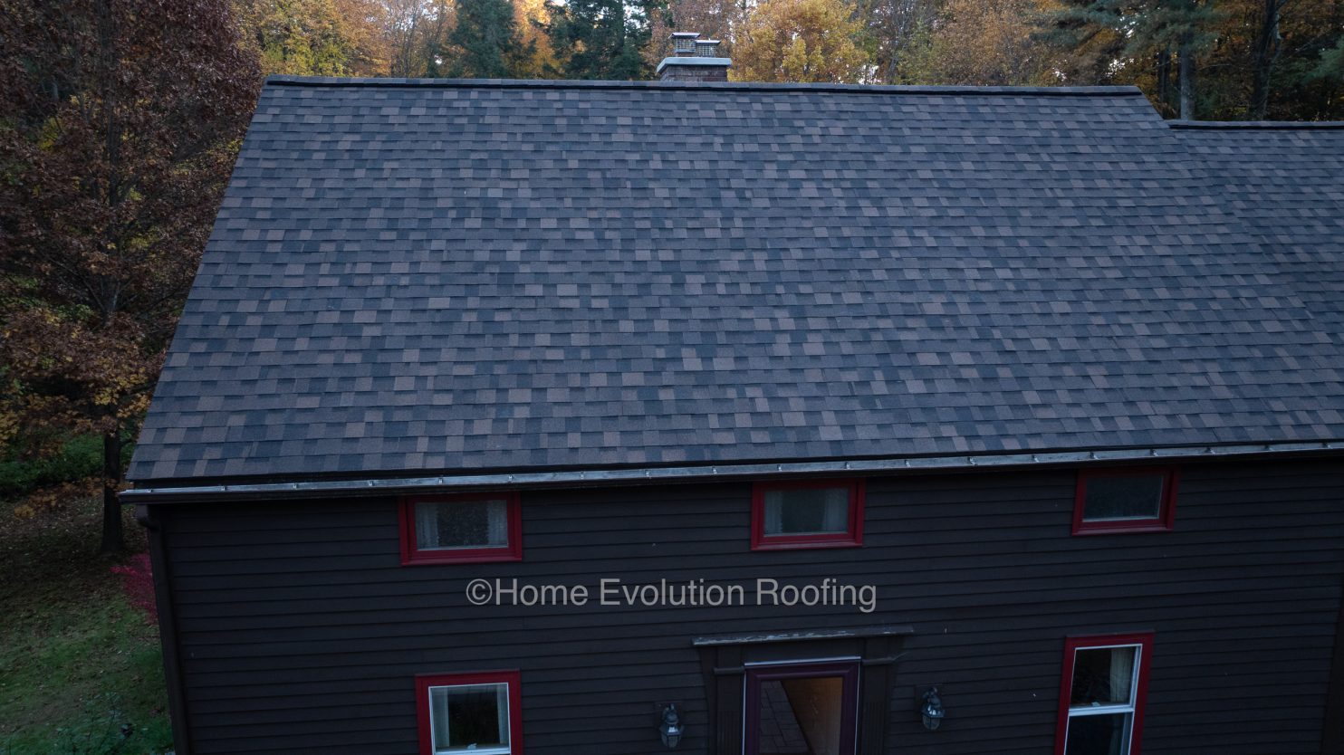 Roofers installing modern shingles on a Saratoga Springs home