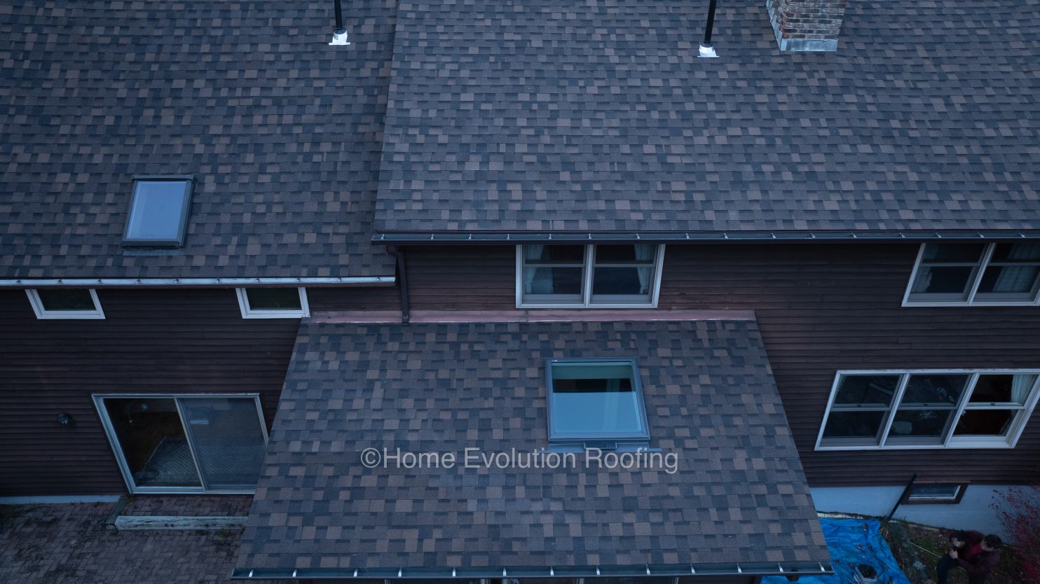 Friendly roofer installing skylight in Saratoga Springs home