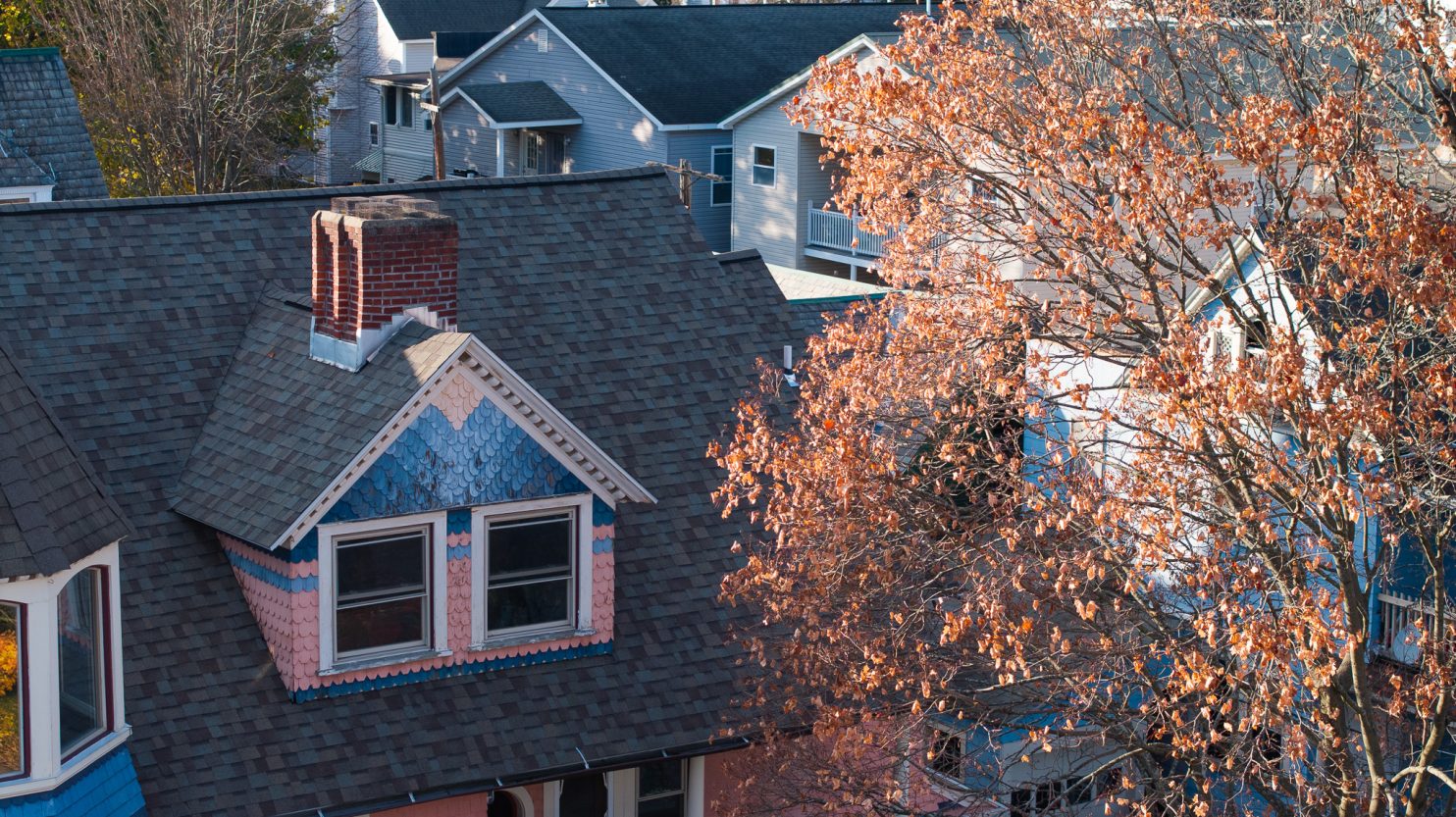 Licensed roofing contractor inspecting Albany NY home
