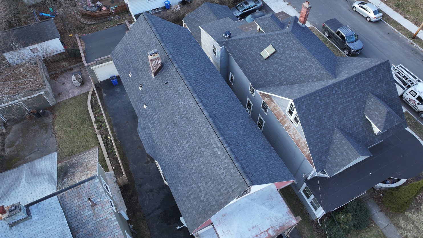 Home Evolution Roofing crew repairing emergency roof damage in Albany NY