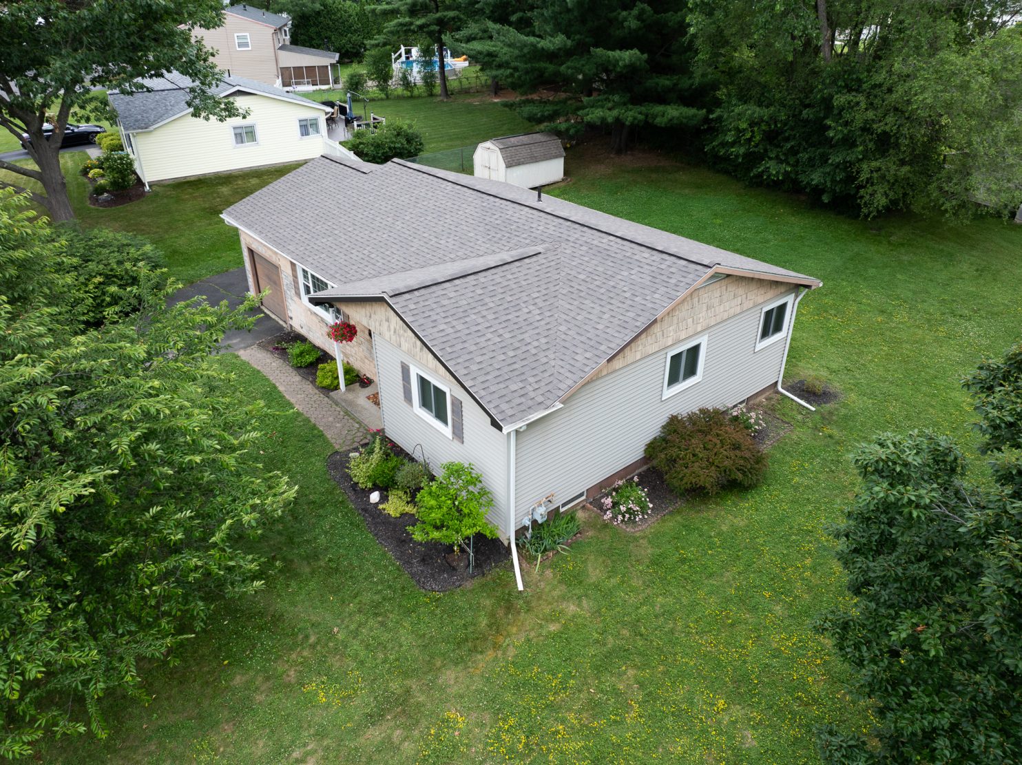 Experienced roofer installing asphalt shingles on a Wappingers Falls NY home