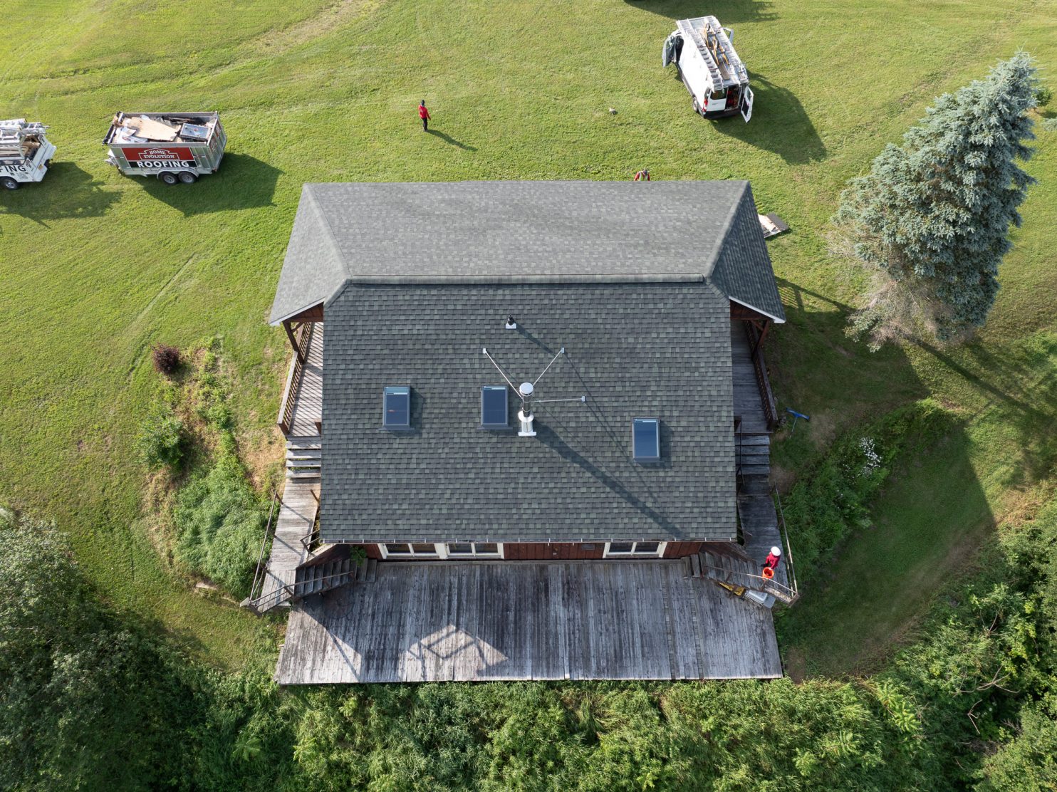 Roofing contractor replacing shingles on a Beekman NY home