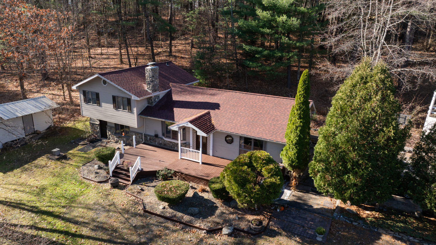 Roofers restoring a slate roof on a historic home in Hyde Park NY