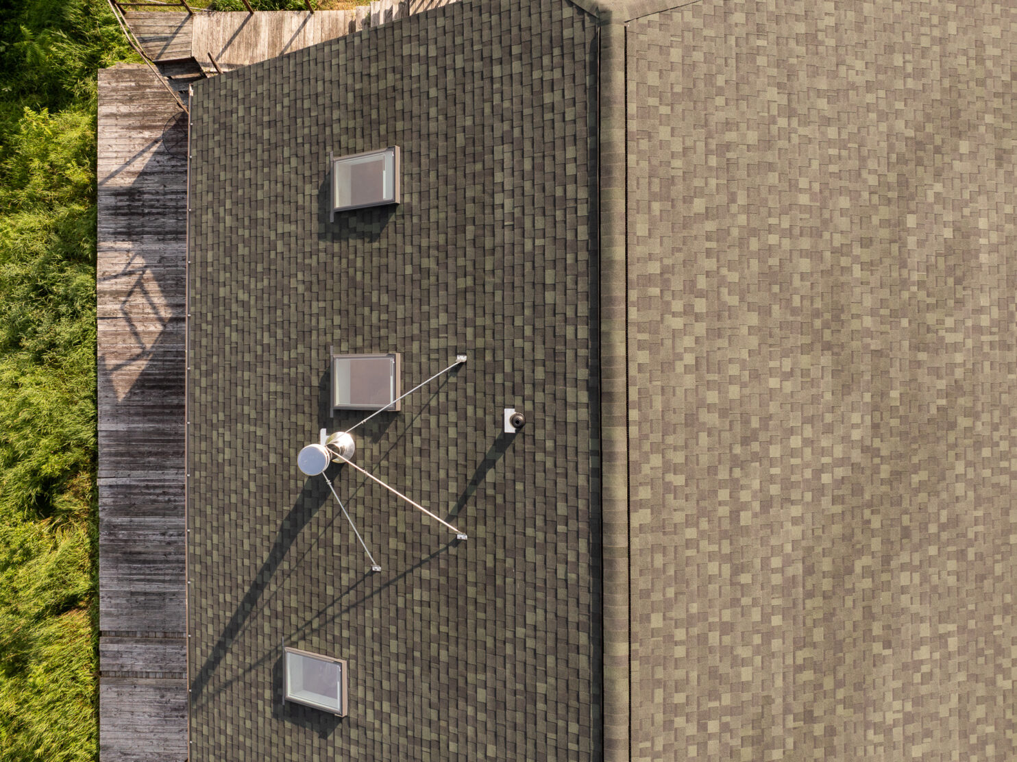 Roofer installing a modern skylight on a home roof in Albany NY
