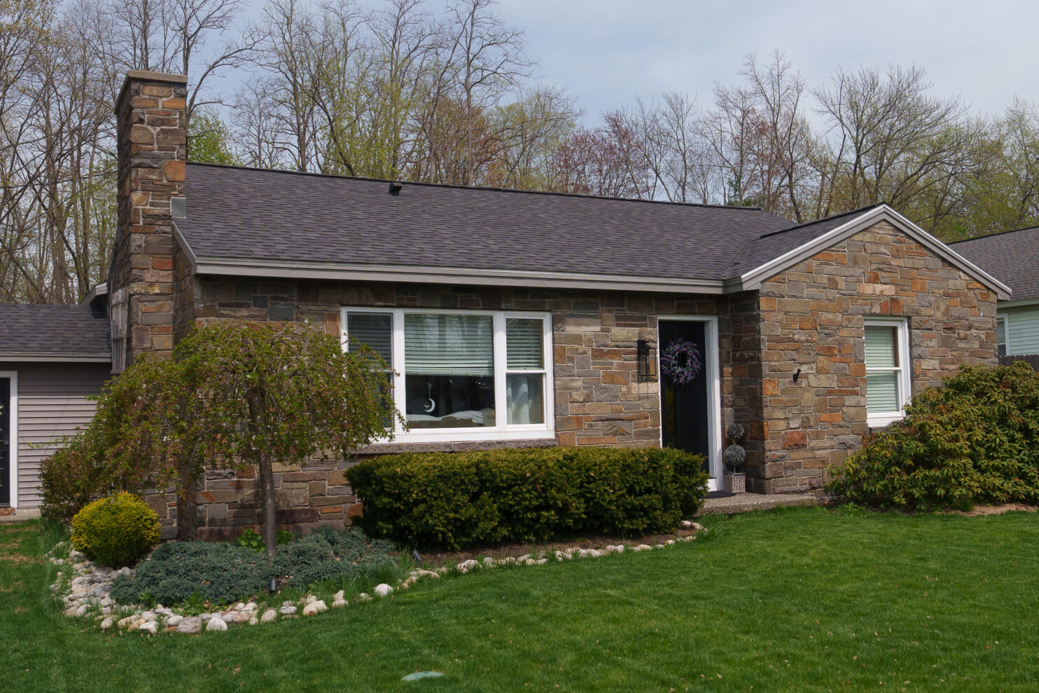 Professional roofer replacing shingles on a rural home in Millerton NY