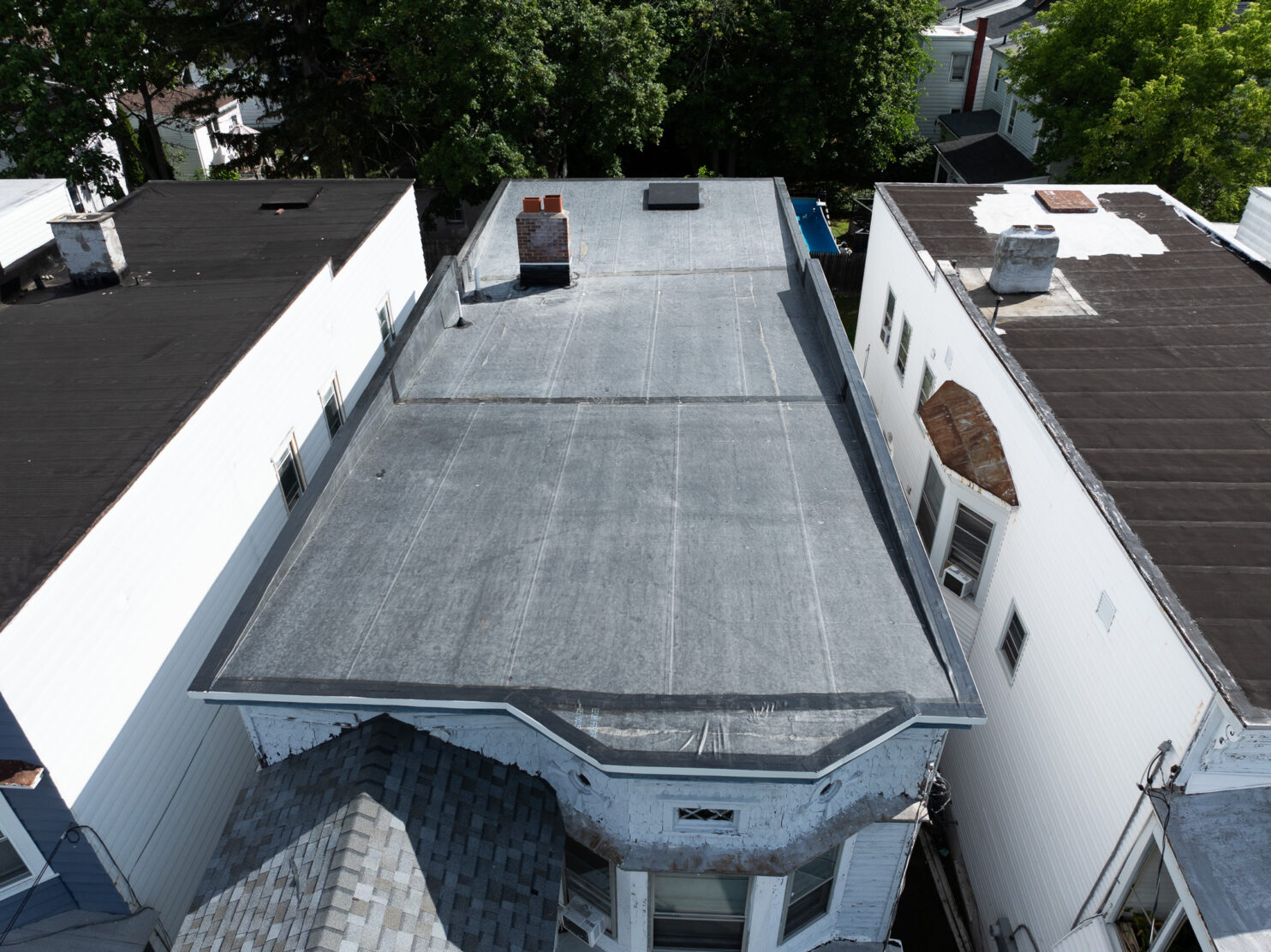 EPDM roofing installation on a commercial building in Saratoga NY during winter