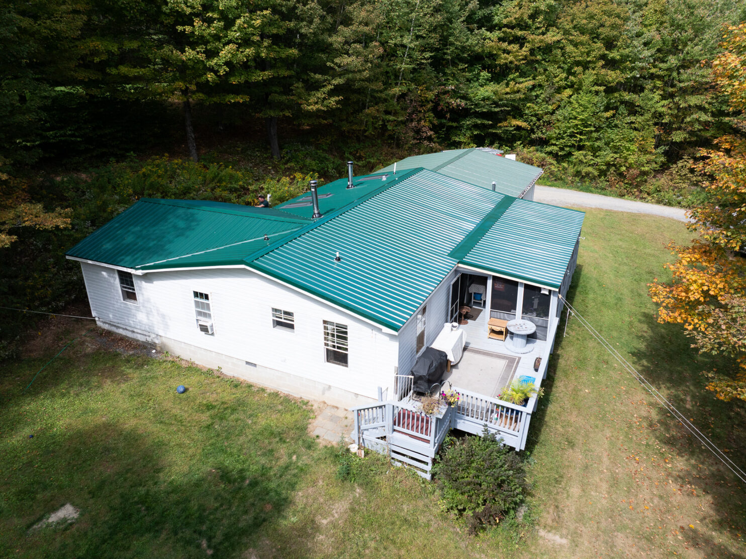 Metal roof installation on a home in Utica NY during winter