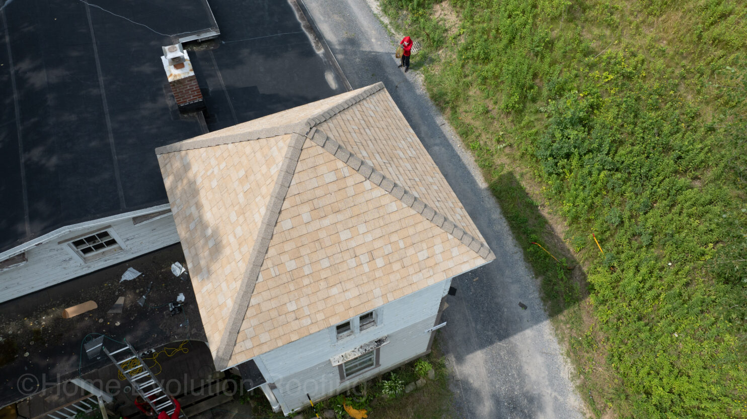 roof repair in Poughkeepsie NY crew fixing winter storm damage on a Dutchess County home