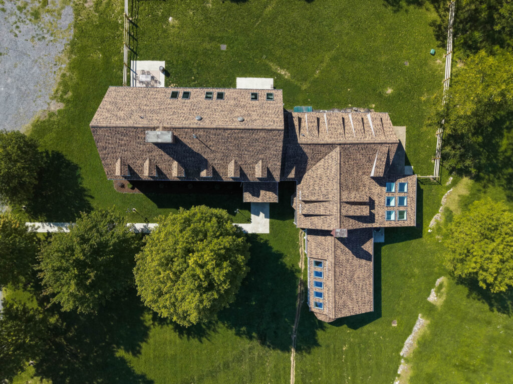 Top-down drone view of a complete 68-square roof replacement in Kingston New York