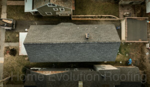 Professional roofing services in Glens Falls, NY, featuring a full roof replacement with impact-resistant shingles