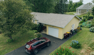 Professional roof replacement in Troy, NY, upgrading to weather-resistant shingles.