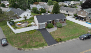 Repairing hail-damaged roof in Germantown, NY, restoring roof integrity.